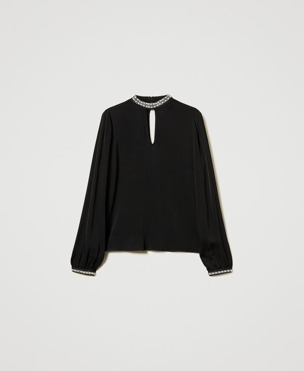 Blusa in crêpe con ricami