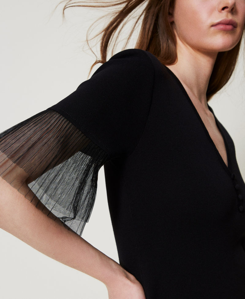 Short knit dress with tulle ruffles
