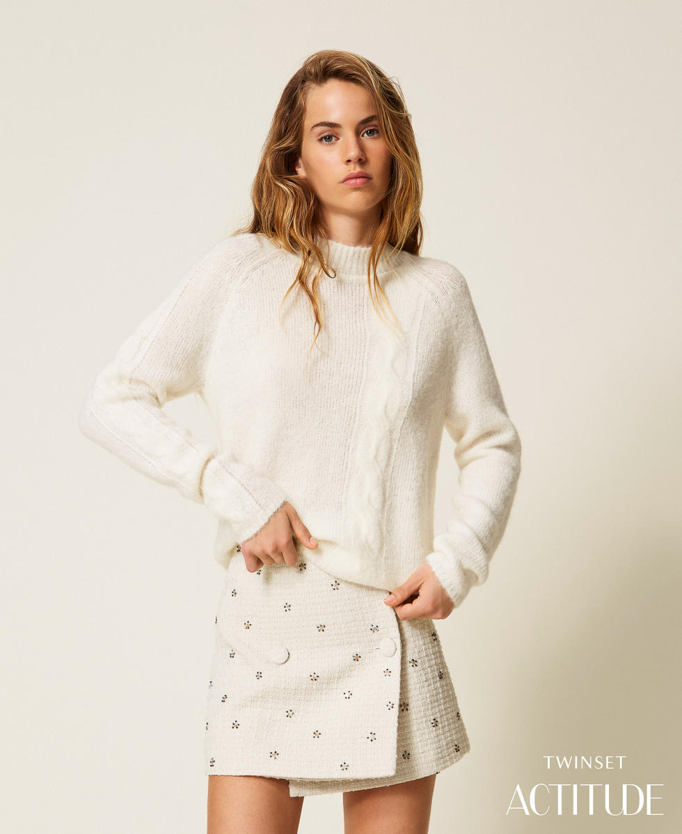Turtleneck jumper with cable knit pattern
