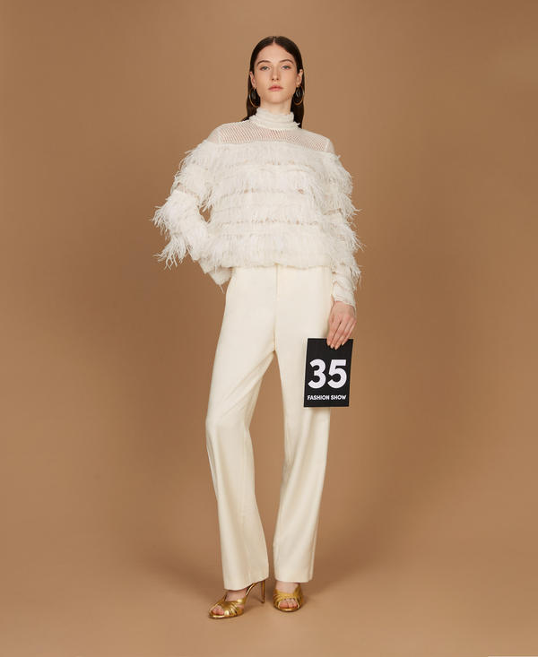 Jumper with ruffles and feathers