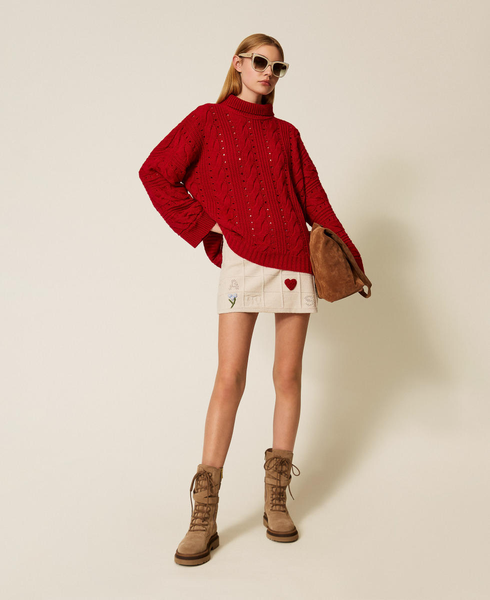 Maxi pull en laine m&eacute;lang&eacute;e avec torsades