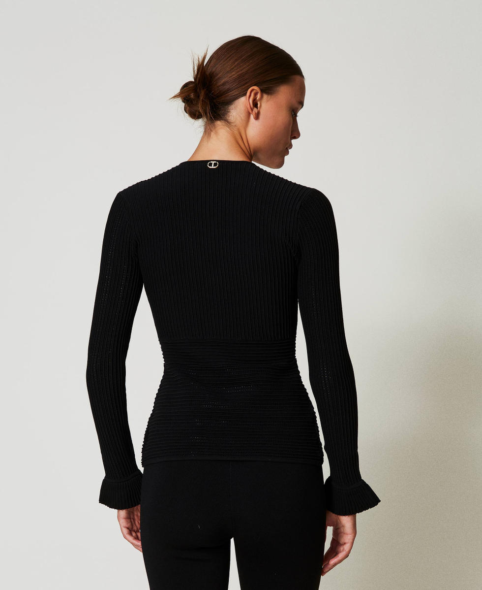 Fitted knit jacket with mixed stitches