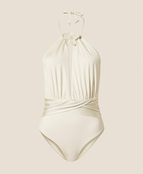 One-piece swimsuit with crochet brooch