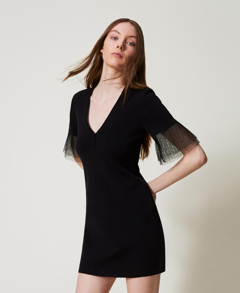 Short knit dress with tulle ruffles