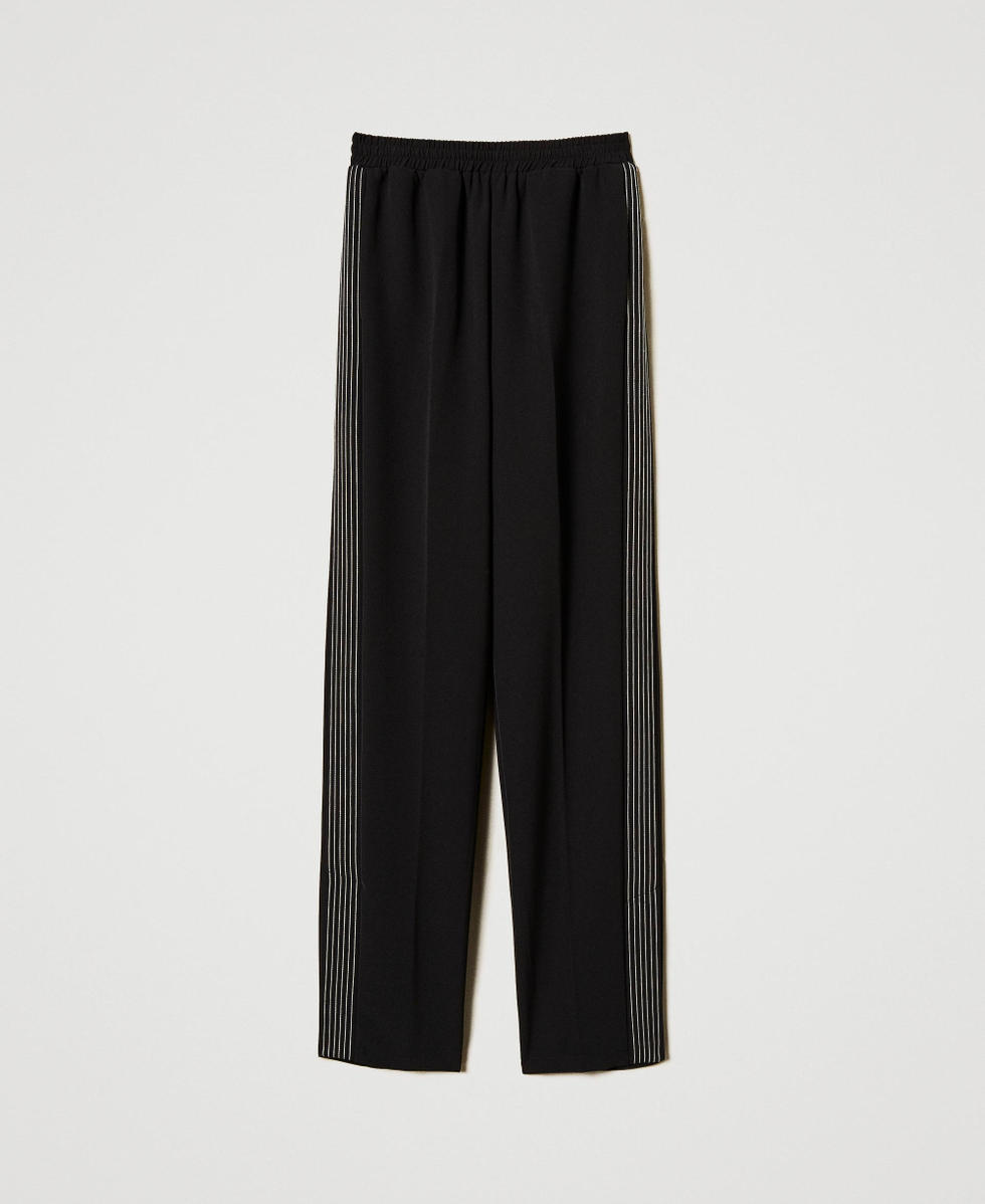 Pantaloni in cr&ecirc;pe con ricamo