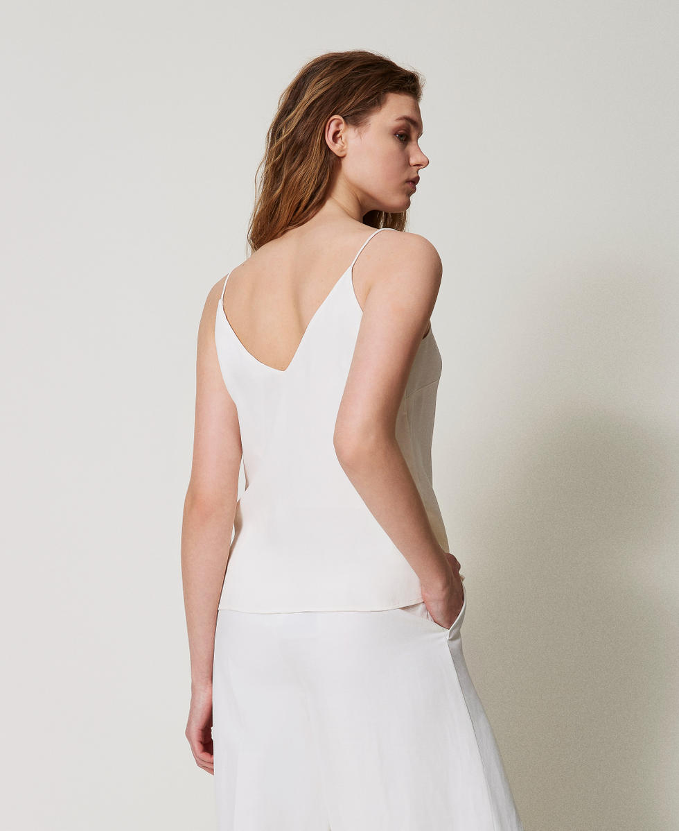 Top with an embroidered butterfly