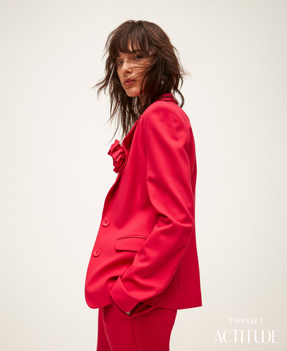 Blazer with floral brooch