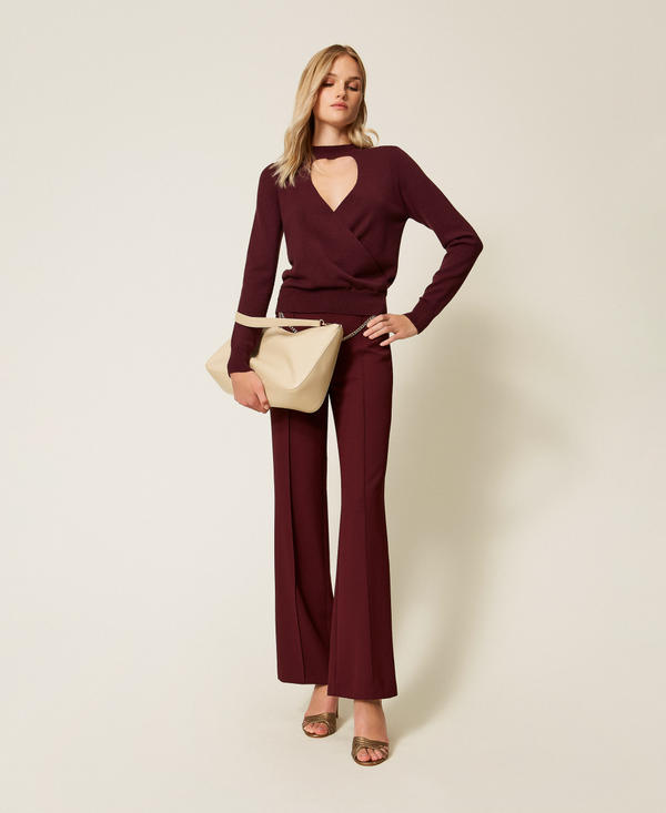 Crossover jumper with cut-outs