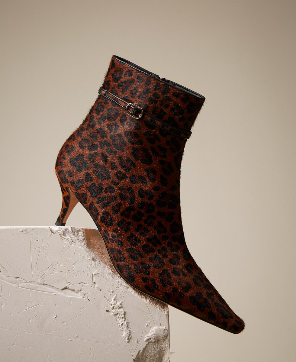 Leather ankle boots with animal print