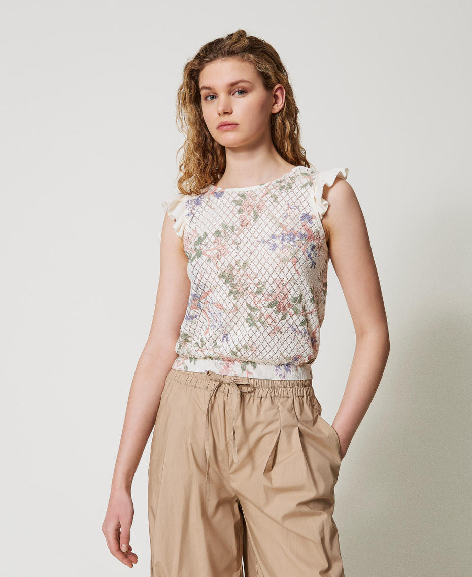 Top in maglia a fiori con volant