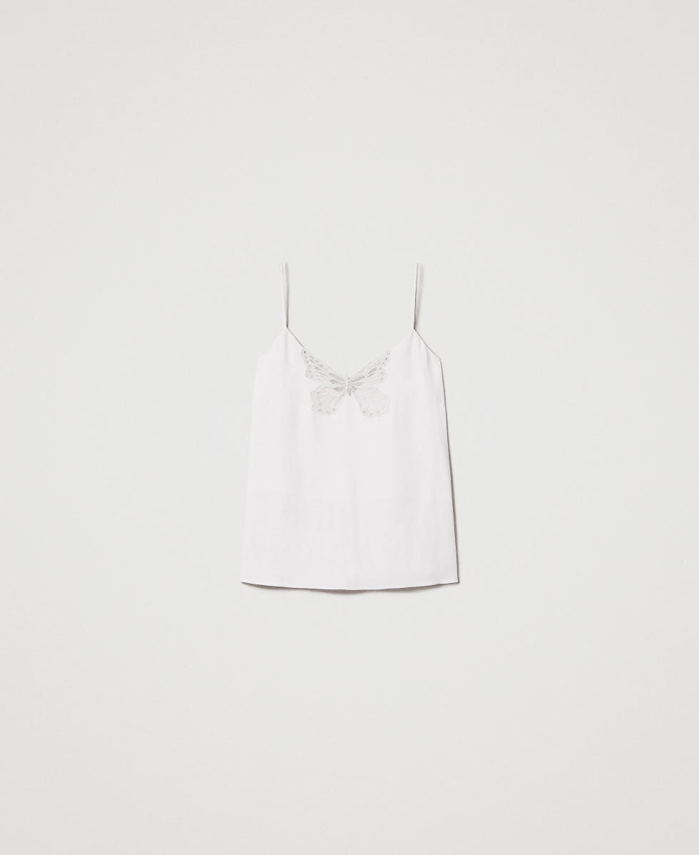 Top with an embroidered butterfly