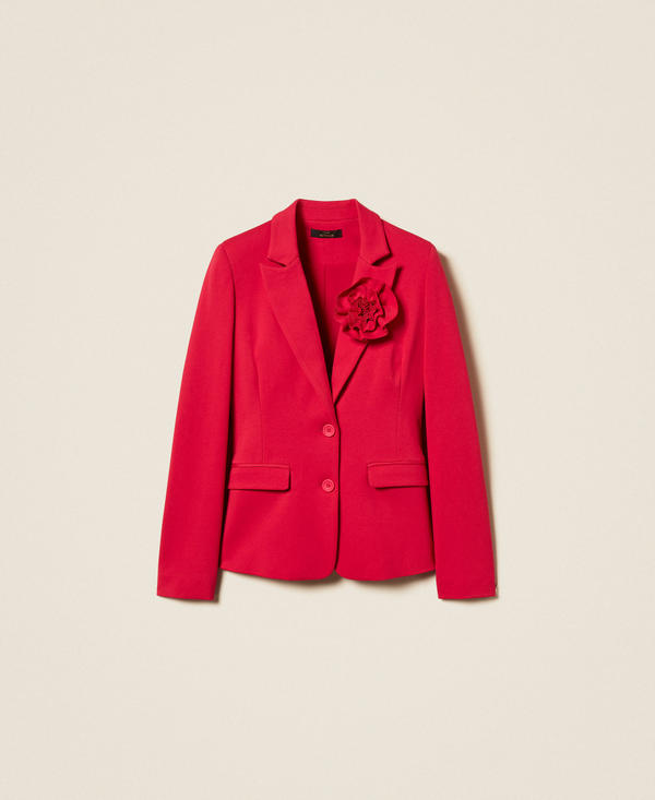 Blazer with floral brooch