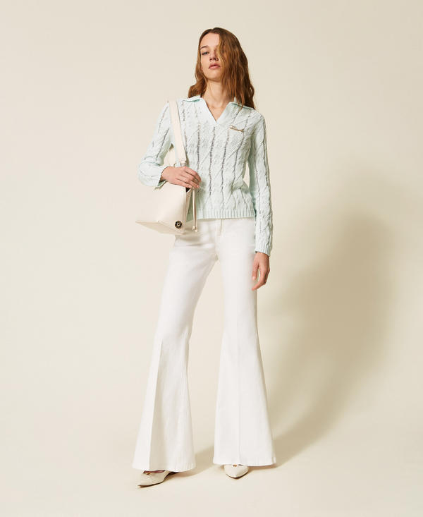 Polo collar cable knit jumper with brooch