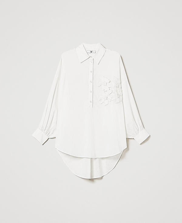 Blusa in mussola con fiori ricamati