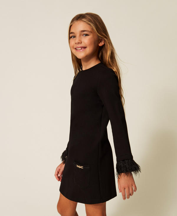 Short dress with pockets and feathers