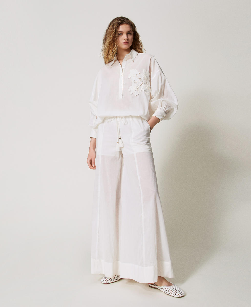 Muslin blouse with embroidered flowers