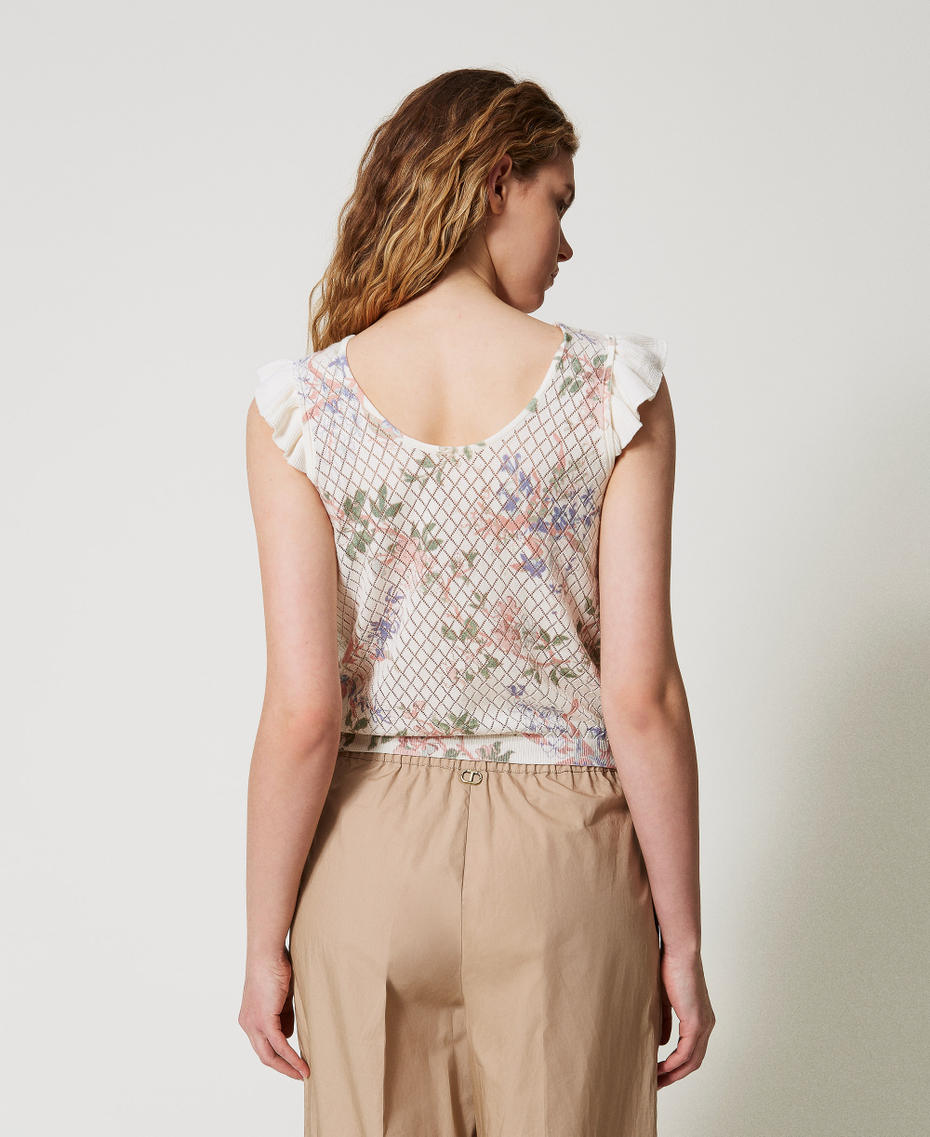 Top in maglia a fiori con volant