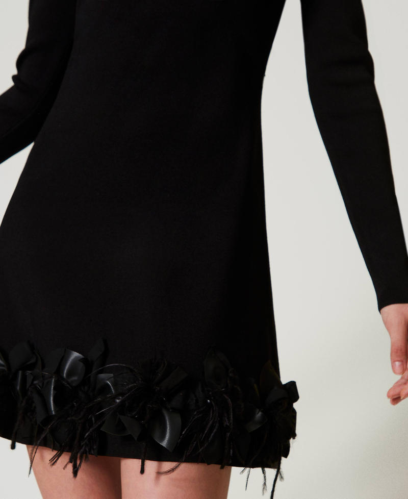 Short knit dress with flowers and feathers