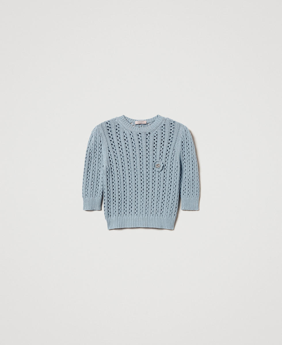 Jumper with crochet brooch