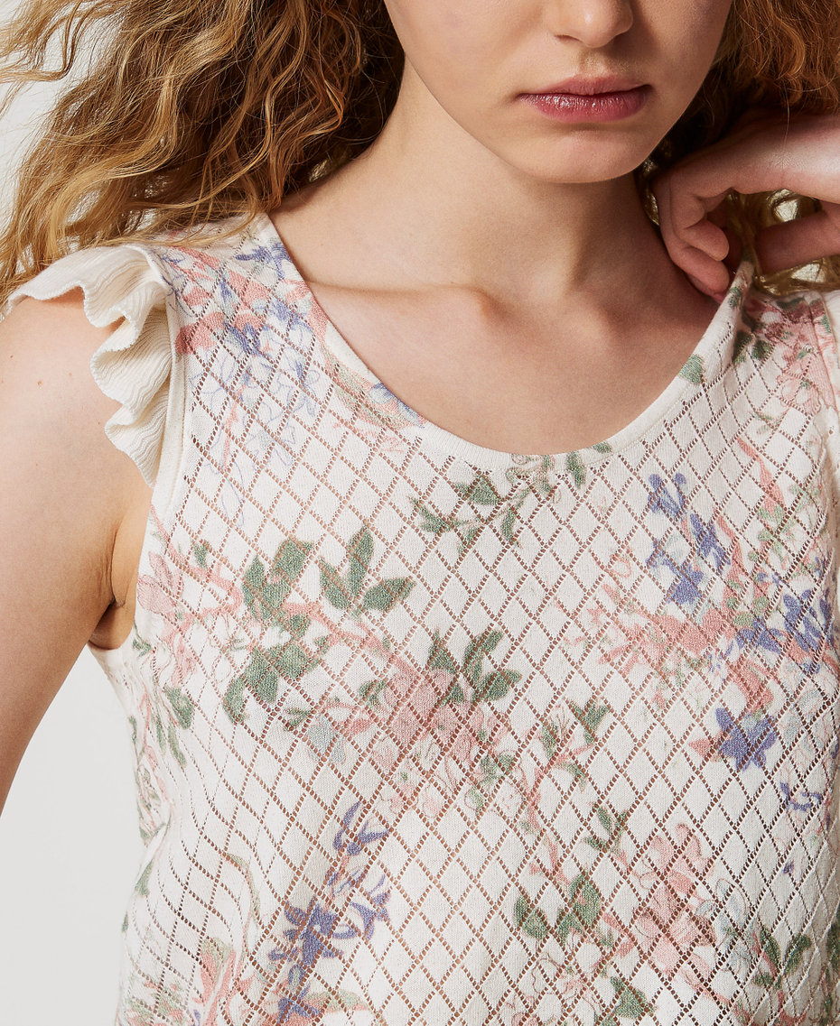 Top in maglia a fiori con volant